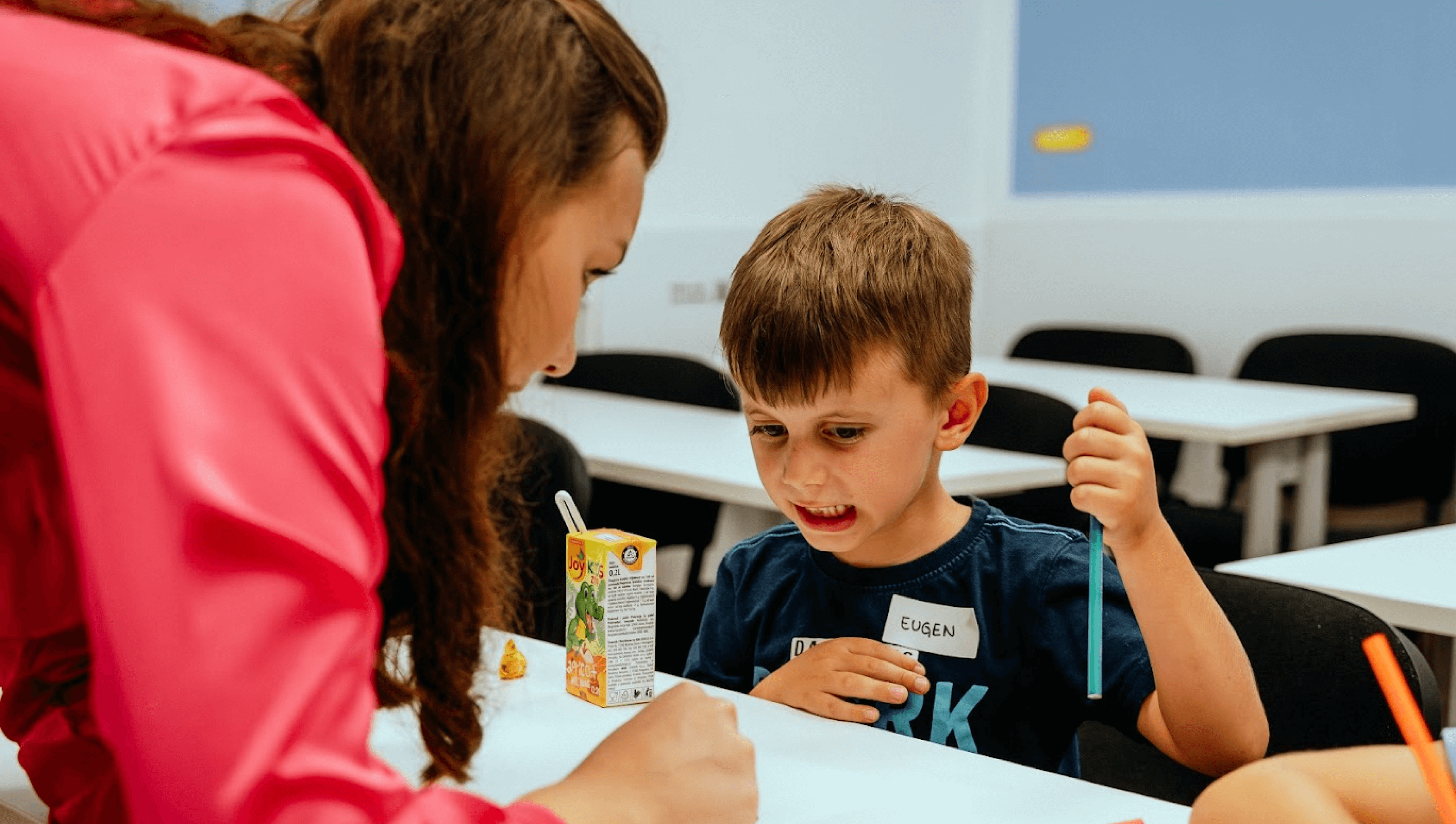 The teacher helps solve the task.