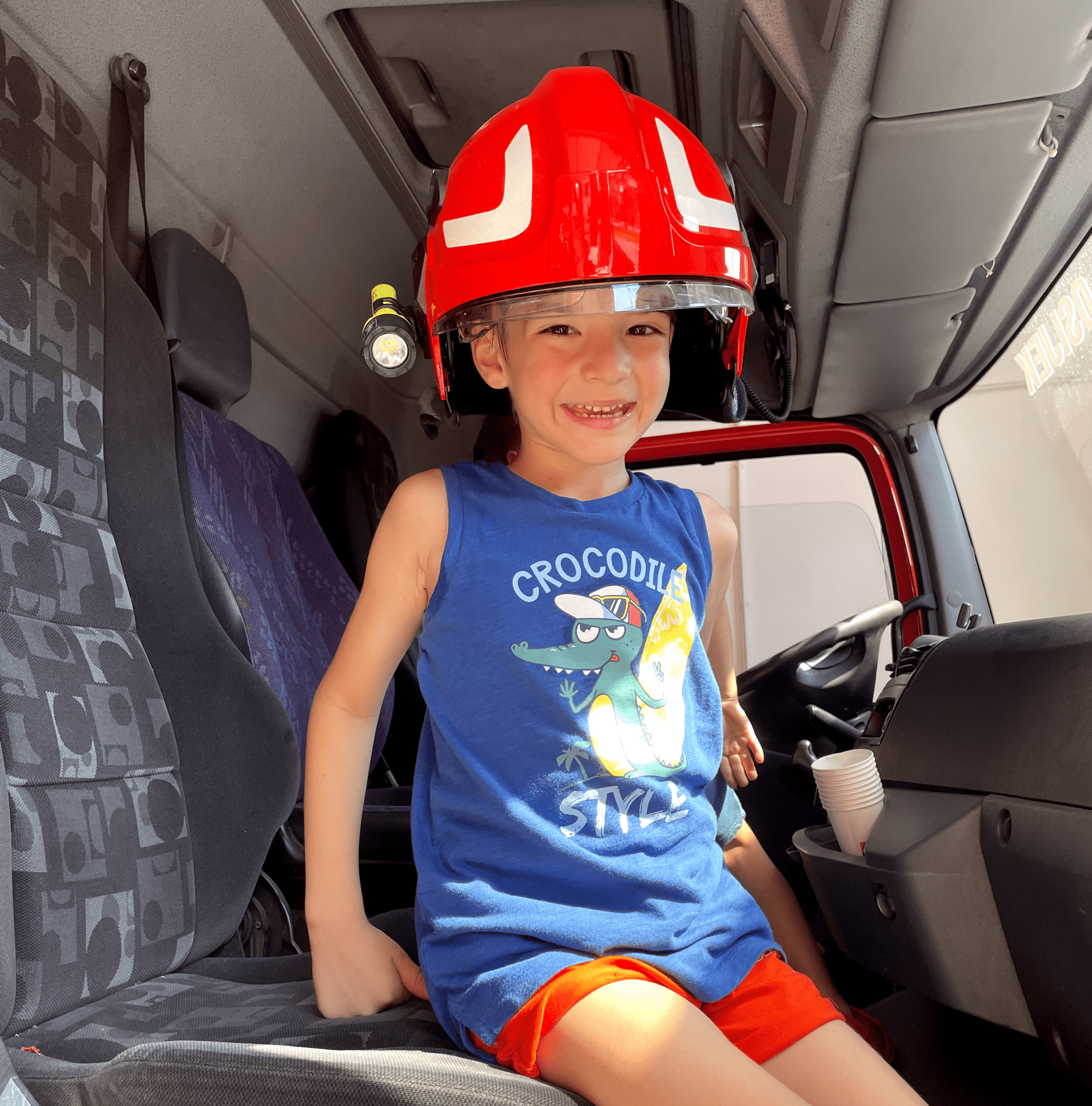 A student with a firefighter helmet. 