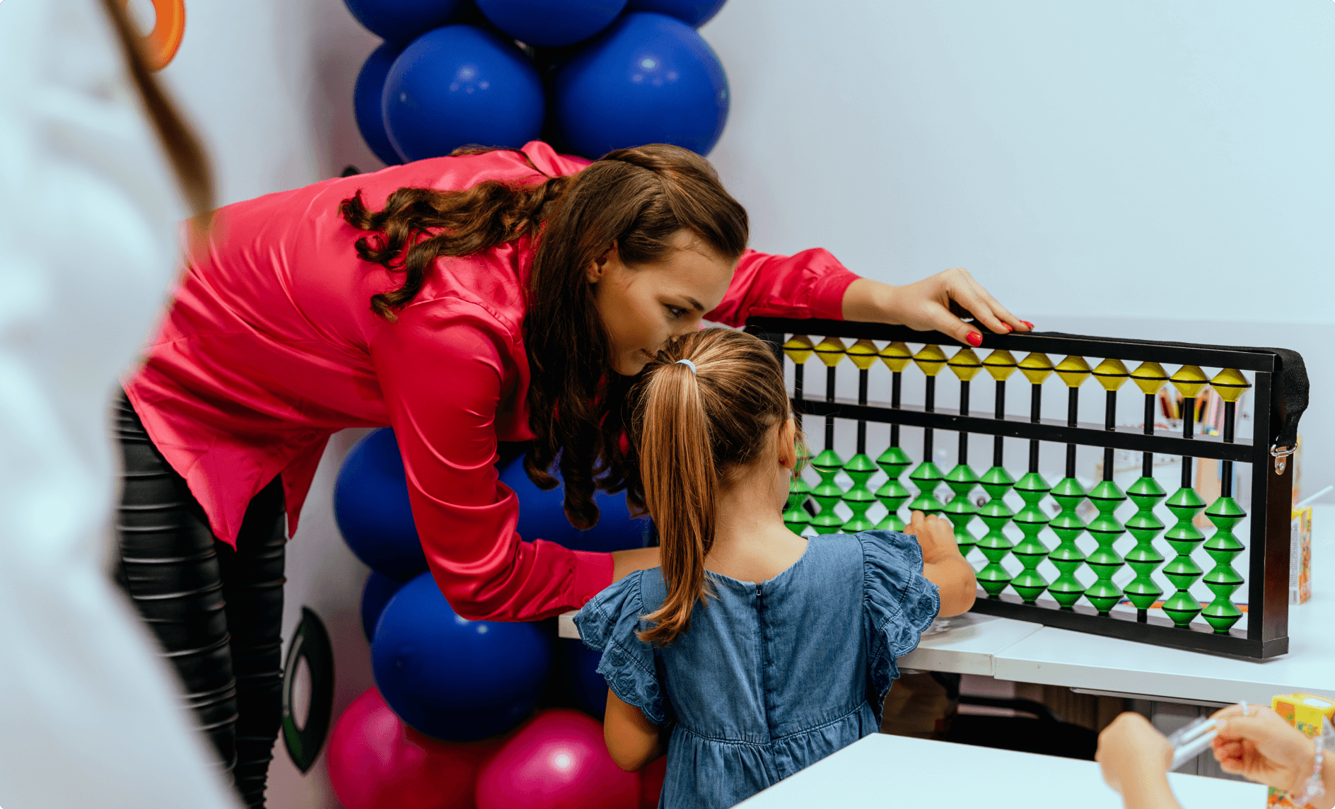 The student is using an abacus. 